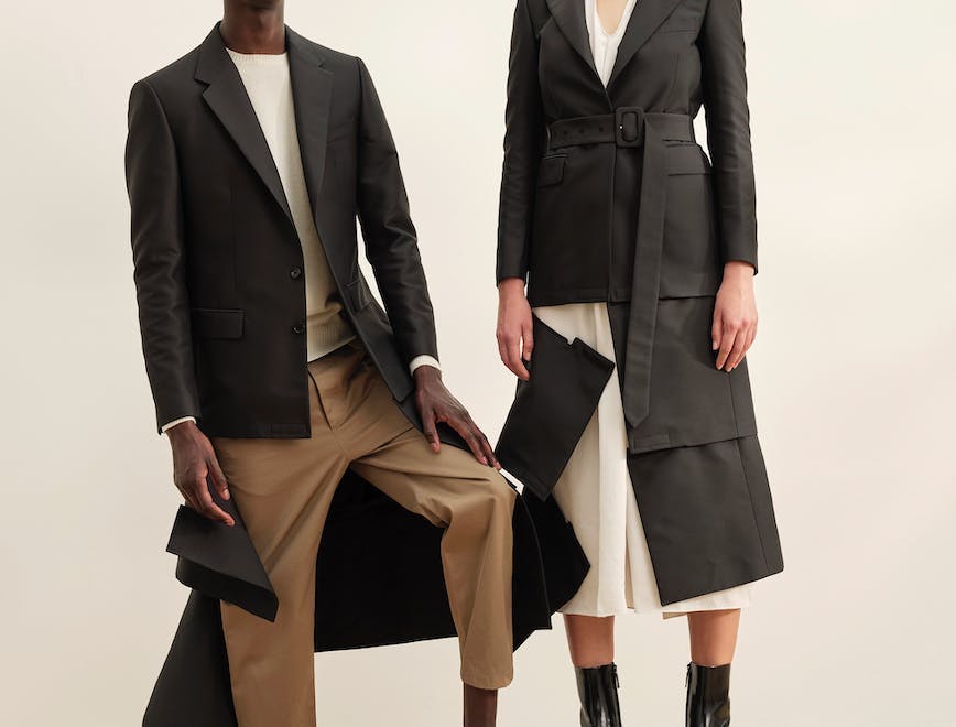 clothing apparel suit overcoat coat person human female woman footwear