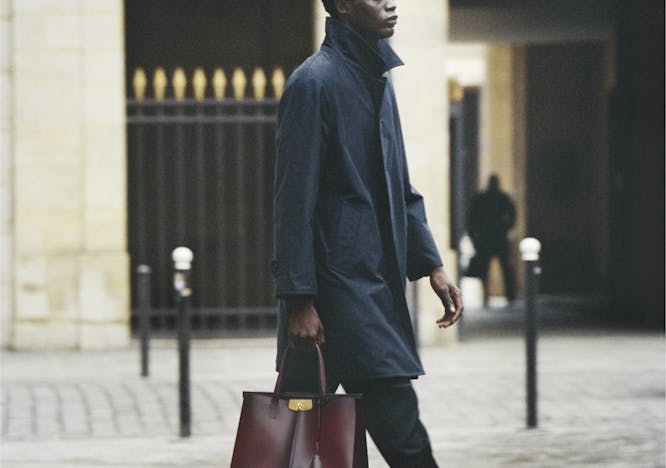 clothing person shoe footwear overcoat coat accessories sleeve handbag bag