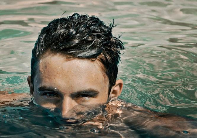 person swimming water bathing adult male man face head portrait