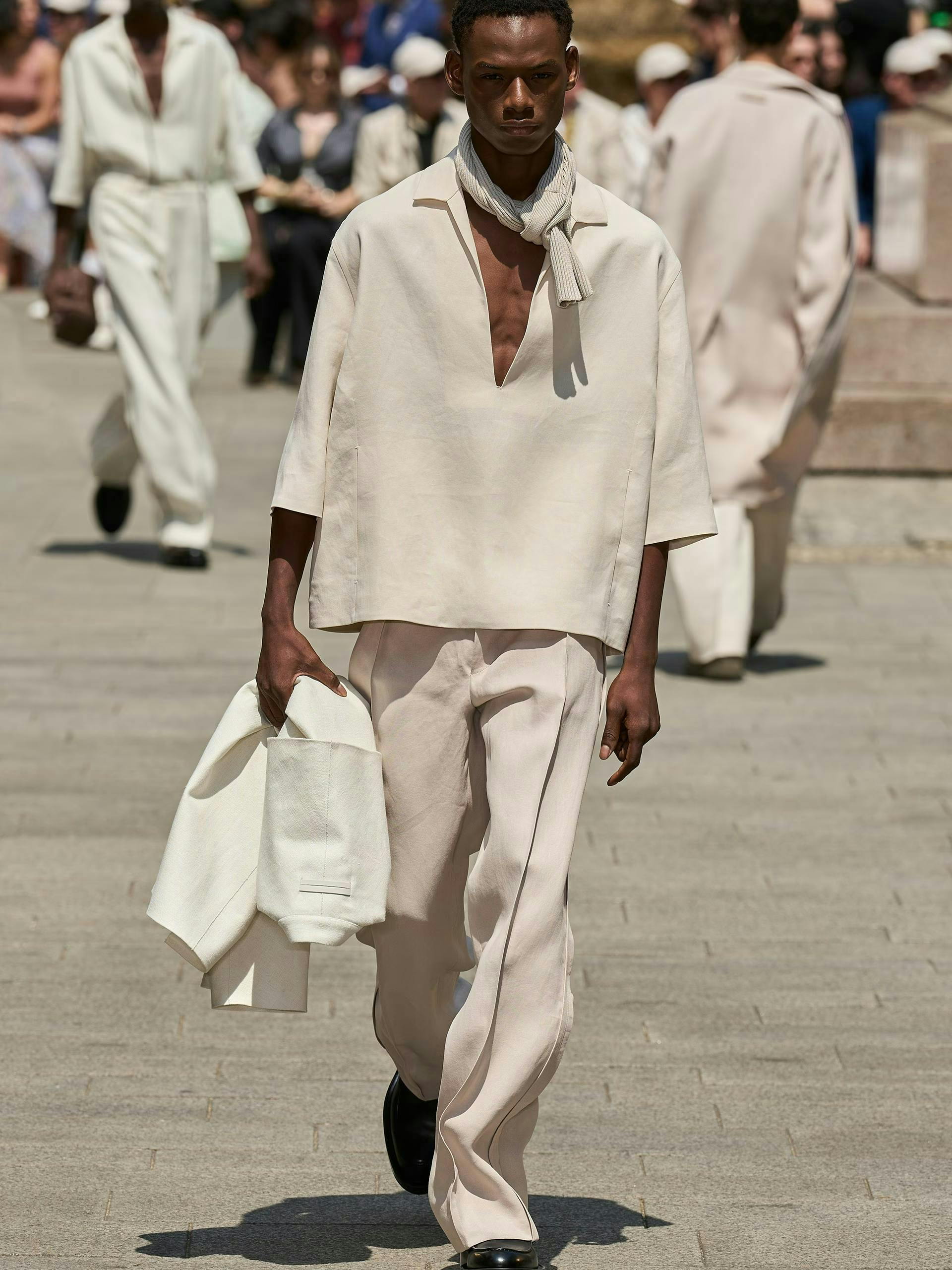 person walking pedestrian coat standing adult male man scarf pajamas