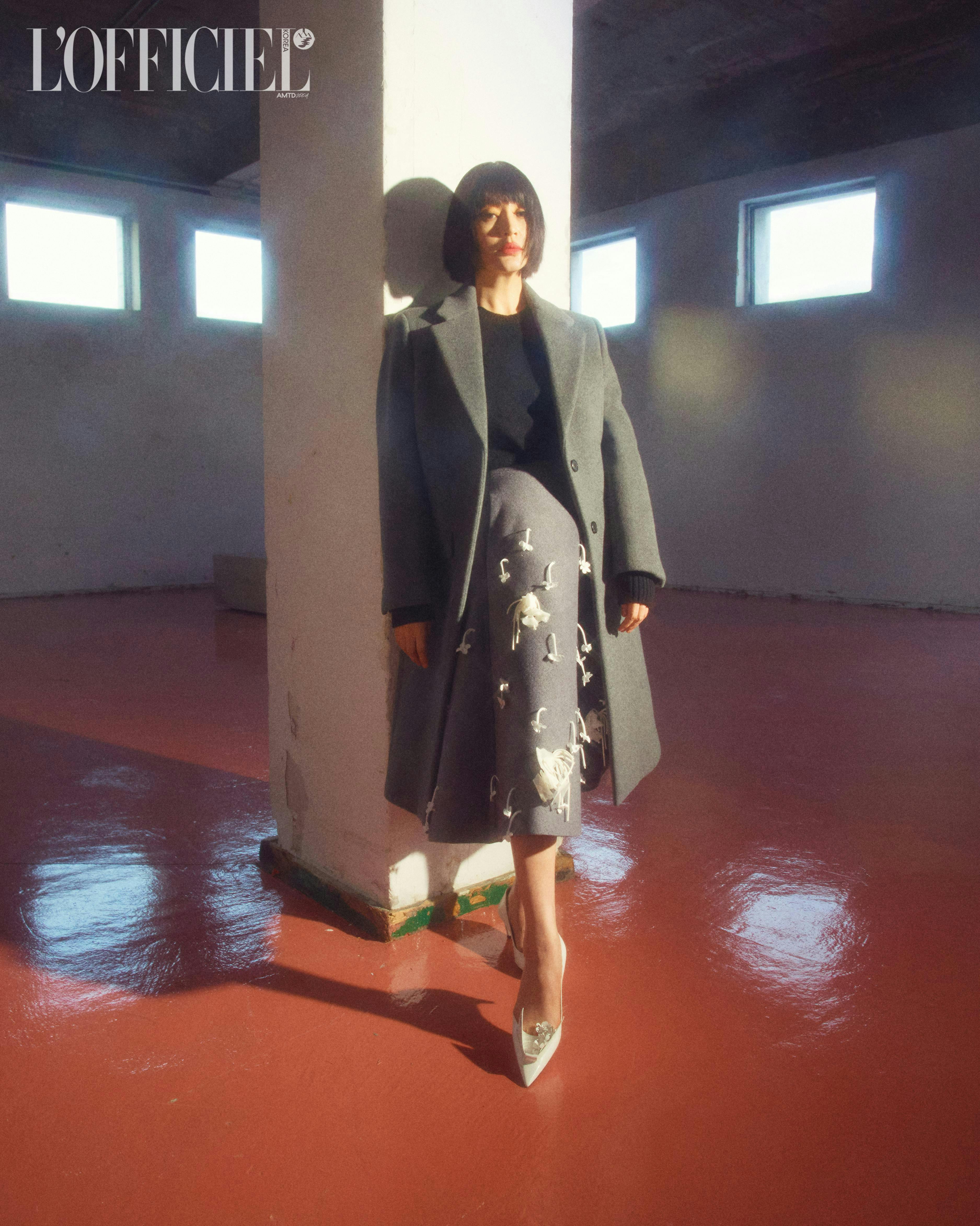 fashion clothing coat floor flooring dress overcoat long sleeve sleeve shoe
